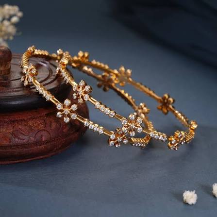 Gold bangles with diamond flowers